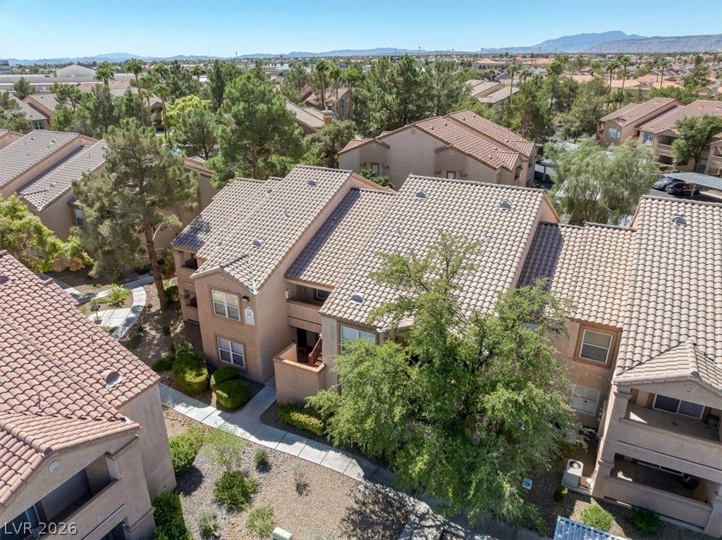 Spanish tile roofs and stucco exteriors define this desert community neighborhood.