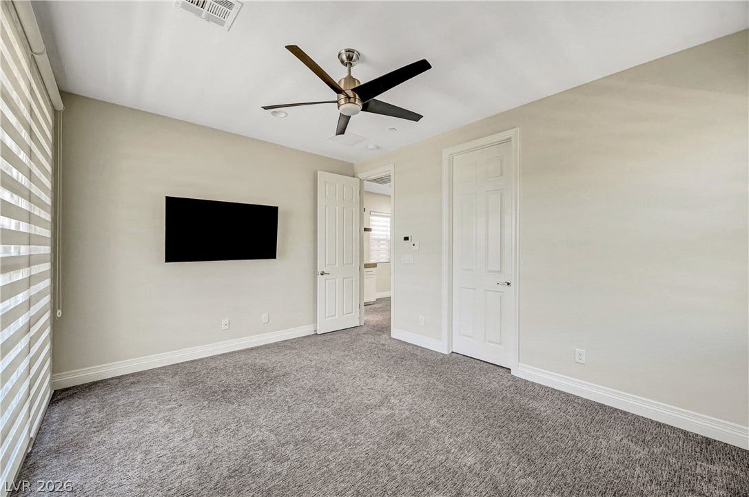 89 Olympia Chase Drive, Las Vegas, NV 89141 Plush carpeting and clean architectural lines create a comfortable and serene atmosphere.