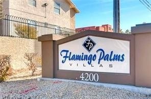 A prominent monument sign marks the entry to this residential community.