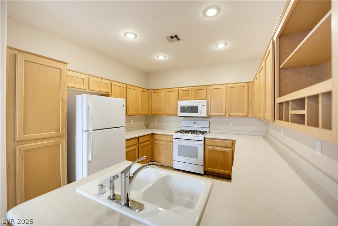 A classic layout and ample cabinet storage define this functional cooking space.