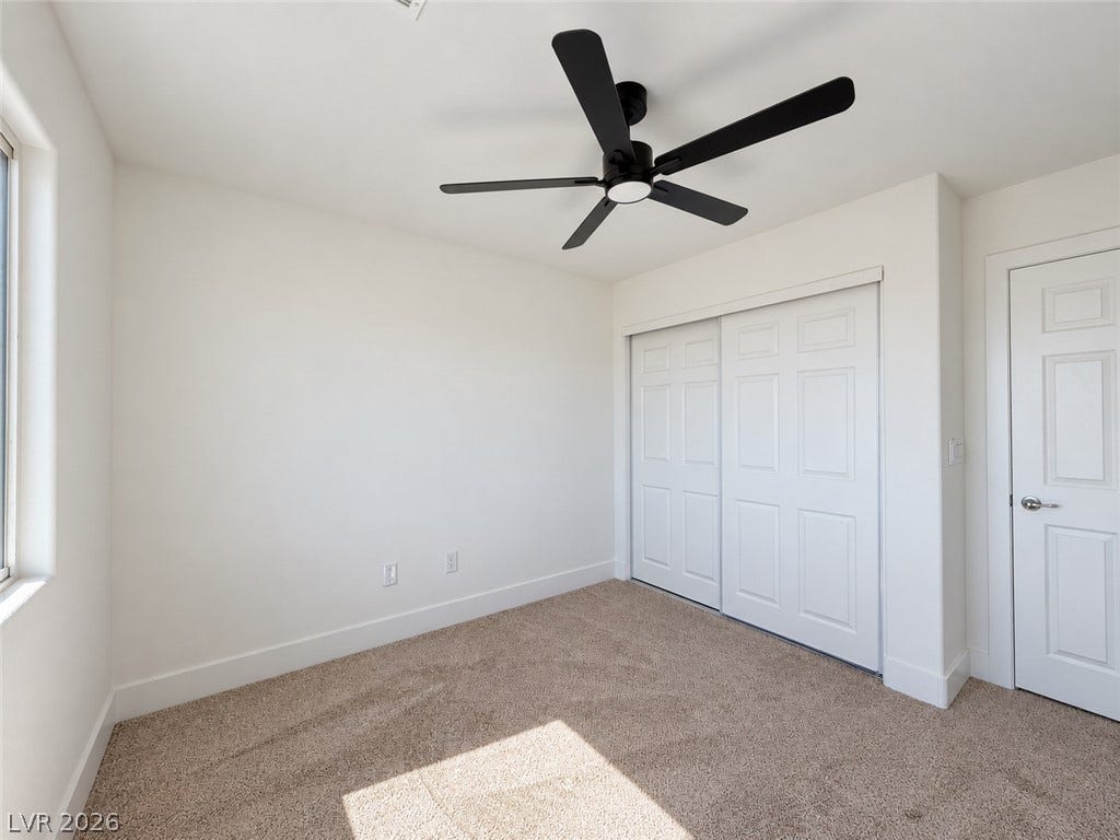 2321 Breckle Key Avenue, North Las Vegas, NV 89081 Plush carpeting and clean walls define this versatile room, accented by a sliding closet door.