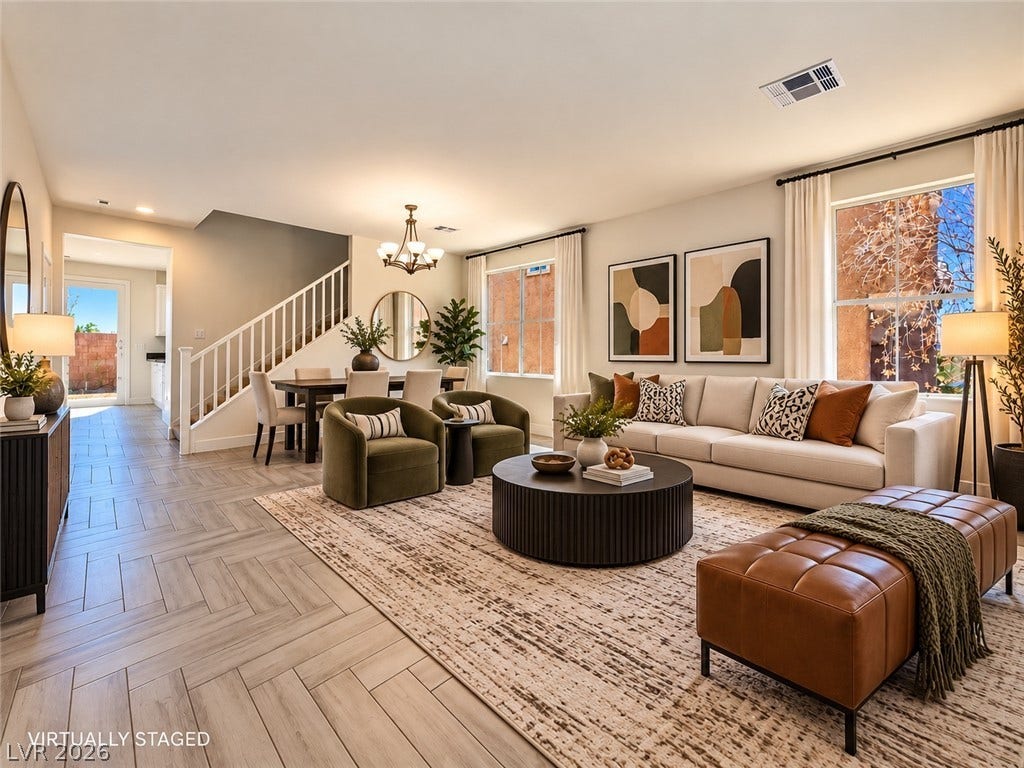2321 Breckle Key Avenue, North Las Vegas, NV 89081 An inviting open-concept living area boasts herringbone-patterned flooring and abundant natural light.