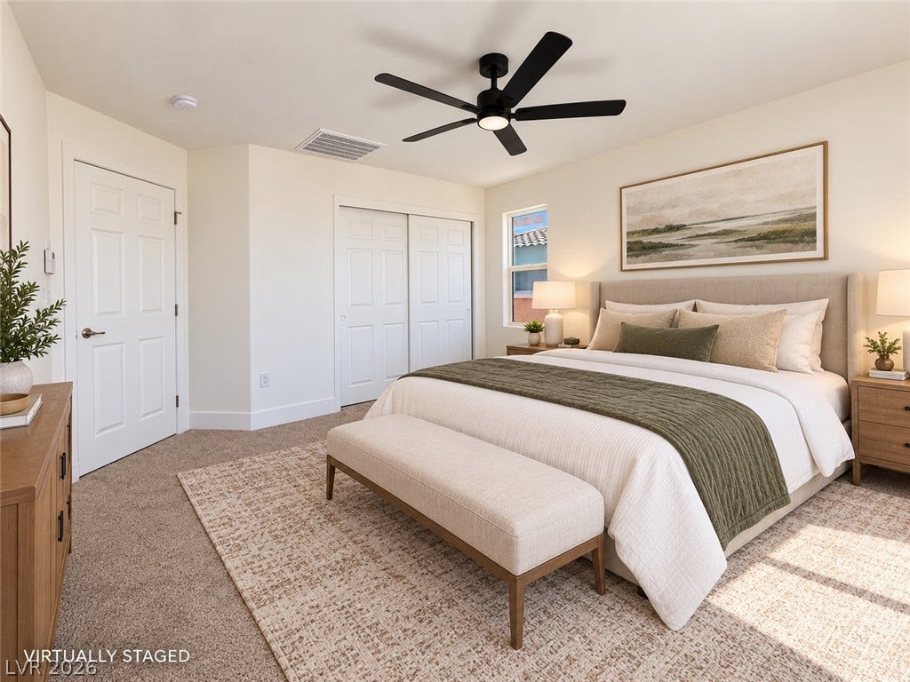 2321 Breckle Key Avenue, North Las Vegas, NV 89081 Plush carpeting and abundant natural light create a serene atmosphere in this bedroom.