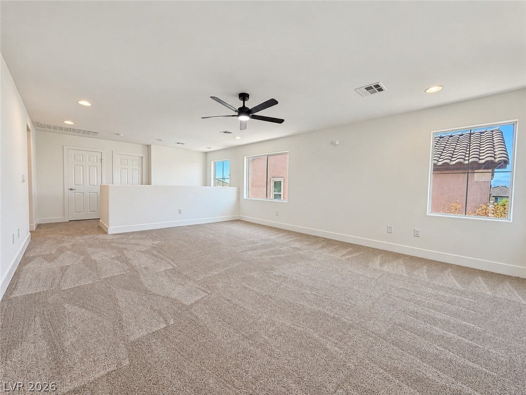 2321 Breckle Key Avenue, North Las Vegas, NV 89081 Plush carpeting and abundant natural light define this versatile upper-level living space.