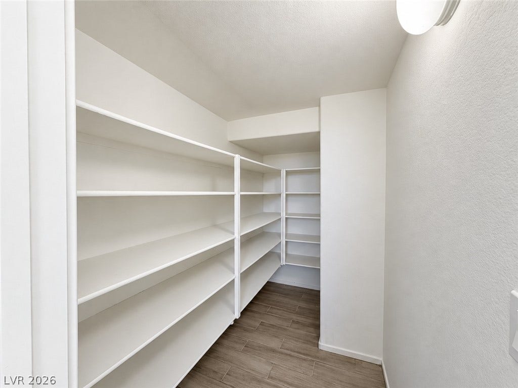 2321 Breckle Key Avenue, North Las Vegas, NV 89081 Generous built-in shelving maximizes storage potential inside this walk-in pantry.