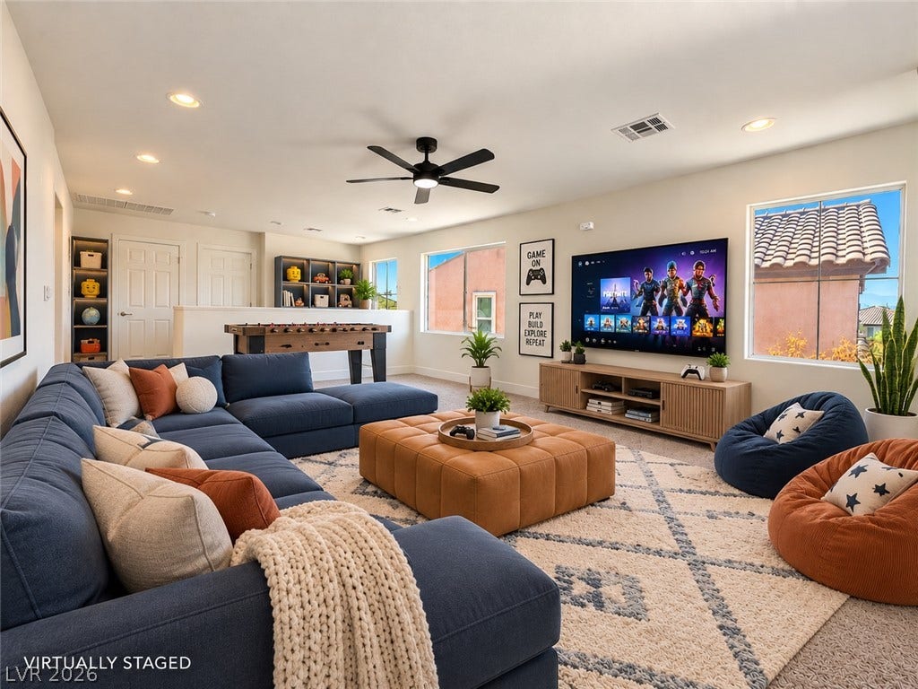 2321 Breckle Key Avenue, North Las Vegas, NV 89081 Recessed lighting and warm carpet enhance this versatile upstairs media and game room.