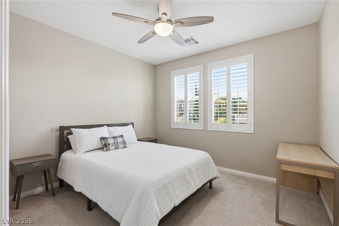 Bedroom 3- Plentiful natural light filters through plantation shutters into this comfortable bedroom with soft carpeting.