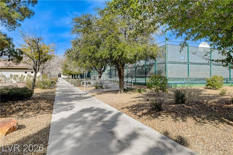 Fenced tennis court.