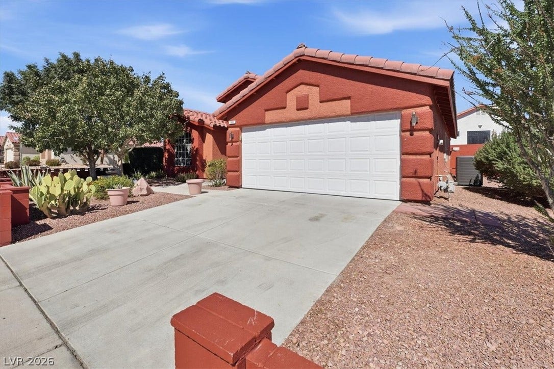 A spacious driveway with potential toy space on the side lot could convert to RV driveway