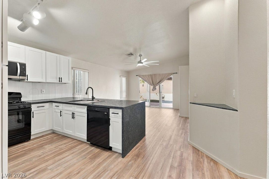 Seamless flow connects the cooking zone directly to the adjacent dining and living areas.