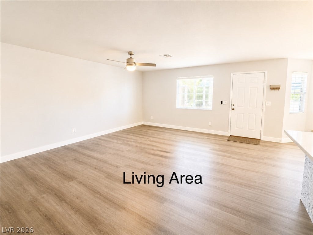 Clean lines and smooth plank flooring define this versatile entry space.