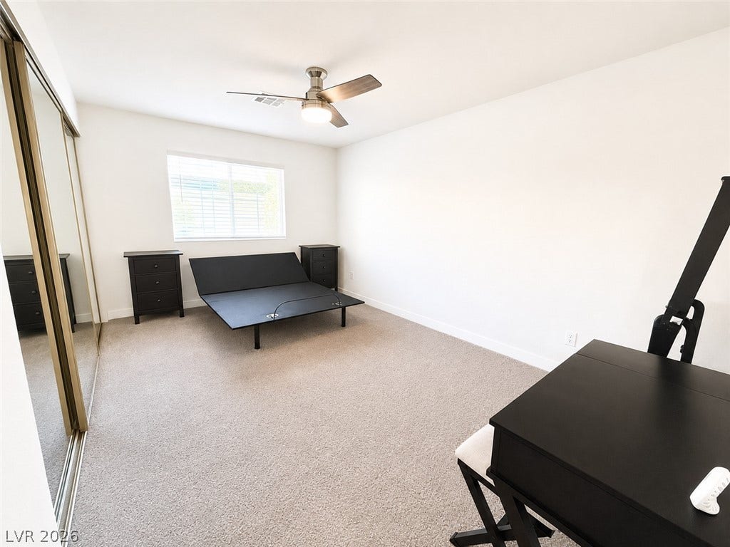 Plush carpeting and mirrored closets enhance this versatile bedroom space.