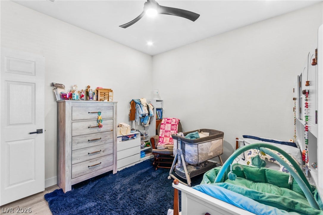 5250 S Rainbow Boulevard, #2033, Las Vegas, NV 89118 Smooth plaster walls and modern recessed lighting frame this versatile secondary bedroom space.