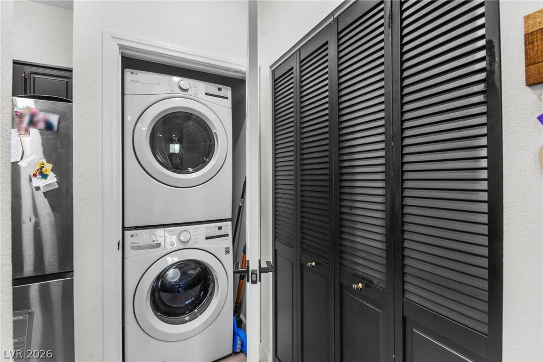 5250 S Rainbow Boulevard, #2033, Las Vegas, NV 89118 A stacked laundry setup integrates seamlessly into this efficient hallway space.
