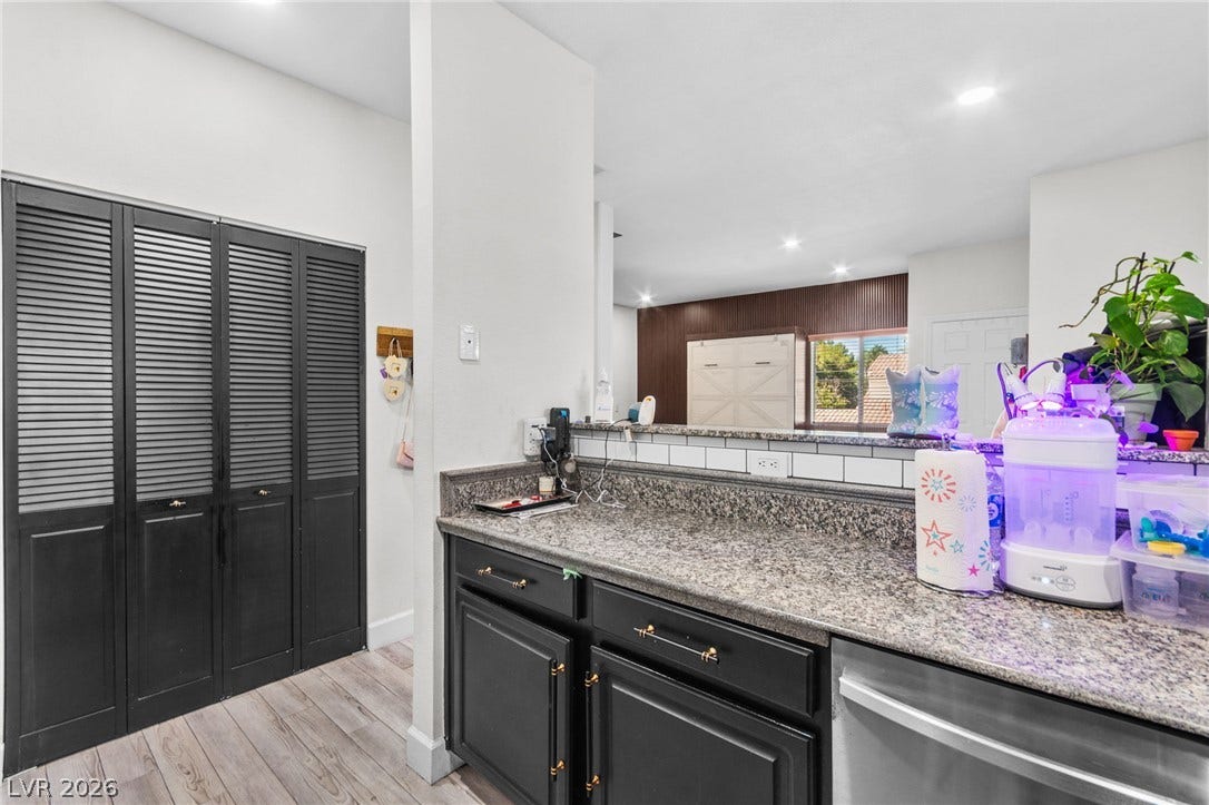 5250 S Rainbow Boulevard, #2033, Las Vegas, NV 89118 Polished stone countertops and clean cabinetry anchor this open culinary workspace.