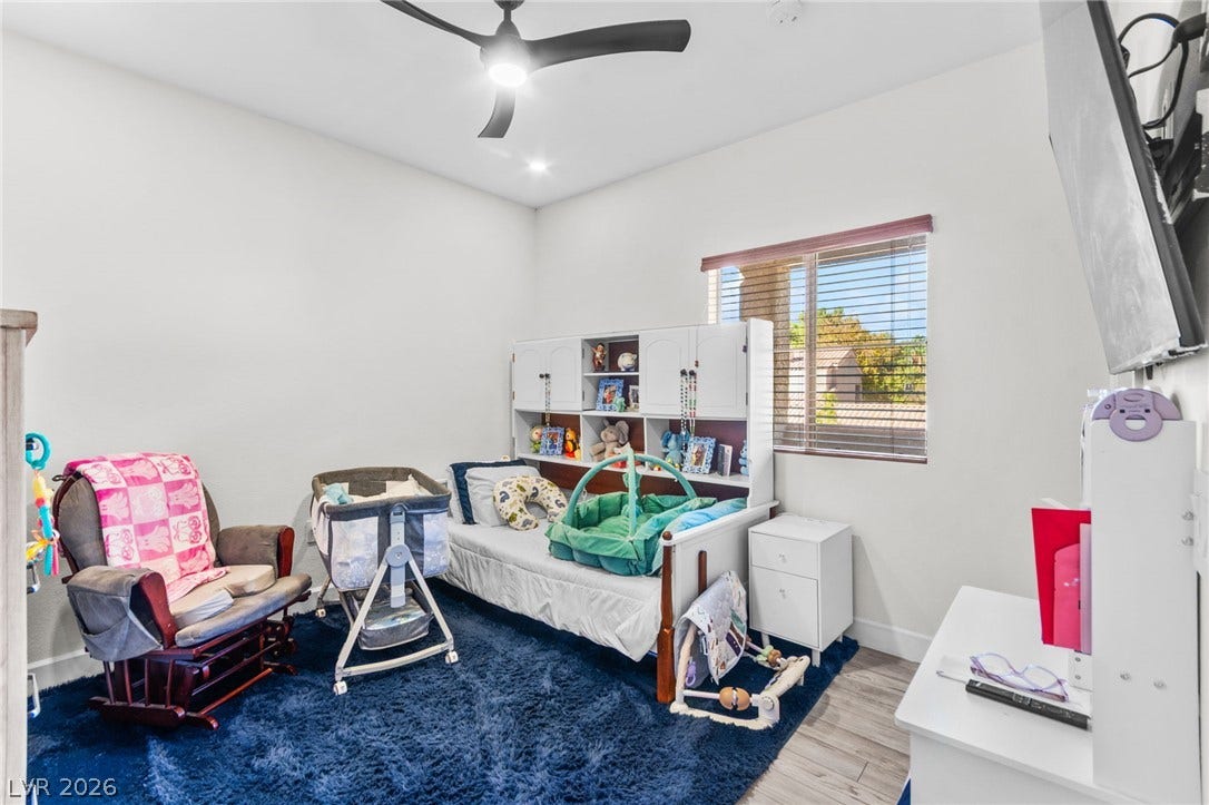 5250 S Rainbow Boulevard, #2033, Las Vegas, NV 89118 Natural light fills this cozy secondary bedroom complete with smooth hard-surface flooring and recessed lighting.