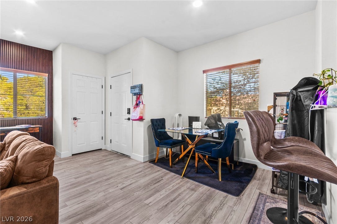 5250 S Rainbow Boulevard, #2033, Las Vegas, NV 89118 Gleaming wood-look floors complement the light-filled, open layout of this inviting living space.