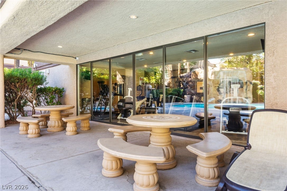 5250 S Rainbow Boulevard, #2033, Las Vegas, NV 89118 A spacious covered patio provides a shaded retreat adjacent to the glass-walled fitness center.