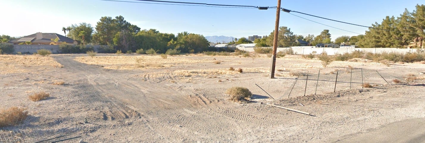 Gilespie Street, Las Vegas, NV 89123 A spacious, level parcel of undeveloped land presents a blank canvas for custom development.