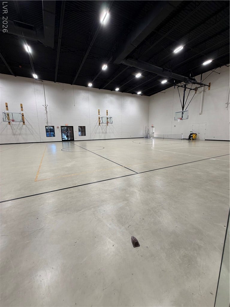 413 Via Gigante, Henderson, NV 89011 An expansive indoor basketball court showcases soaring ceilings and polished concrete floors.