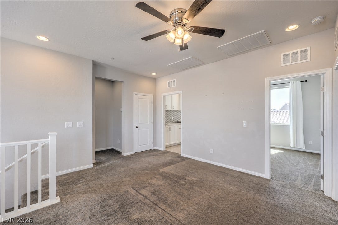 413 Via Gigante, Henderson, NV 89011 A versatile open landing area awaits, connecting various living spaces with ease and featuring a welcoming stairwell.