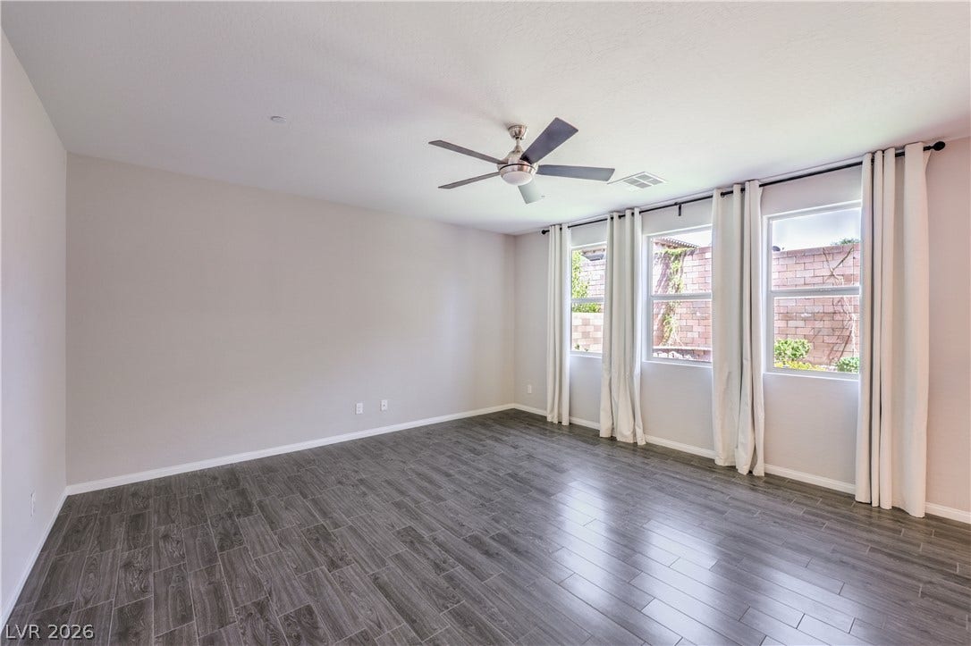 413 Via Gigante, Henderson, NV 89011 A well-lit interior space with sleek wood-look tile flooring.
