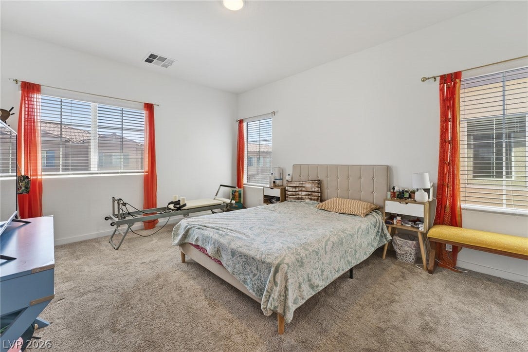 3700 Canis Minor Lane, #19206, Henderson, NV 89052 Multiple windows draw ample natural light across this carpeted bedroom.