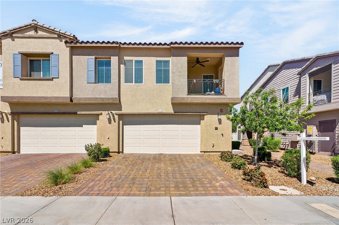 3700 Canis Minor Lane, #19206, Henderson, NV 89052 Stucco exterior walls and a tiled roof define this modern multi-level townhouse design.