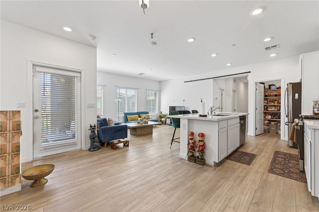 3700 Canis Minor Lane, #19206, Henderson, NV 89052 An open concept floor plan seamlessly connects the kitchen and living spaces under recessed lighting.