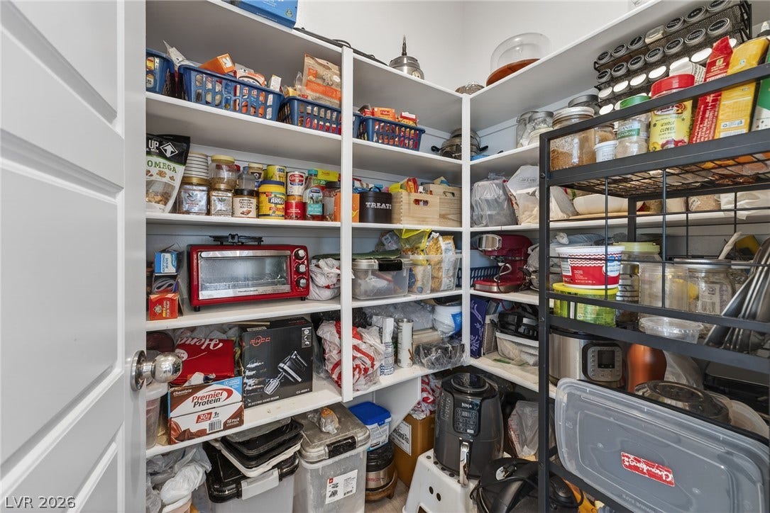 3700 Canis Minor Lane, #19206, Henderson, NV 89052 Floor-to-ceiling built-in shelving maximizes storage potential in this walk-in kitchen pantry.