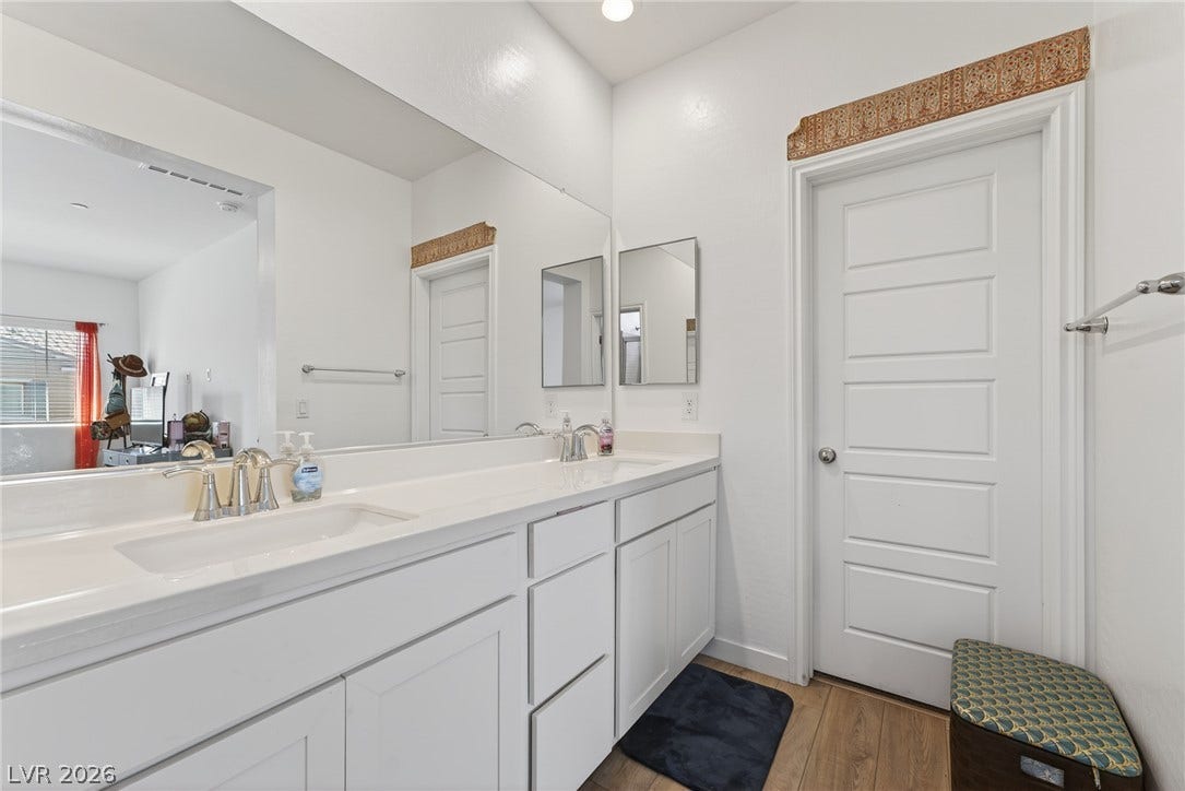 3700 Canis Minor Lane, #19206, Henderson, NV 89052 Clean lines and a spacious double vanity define this modern bathroom space.