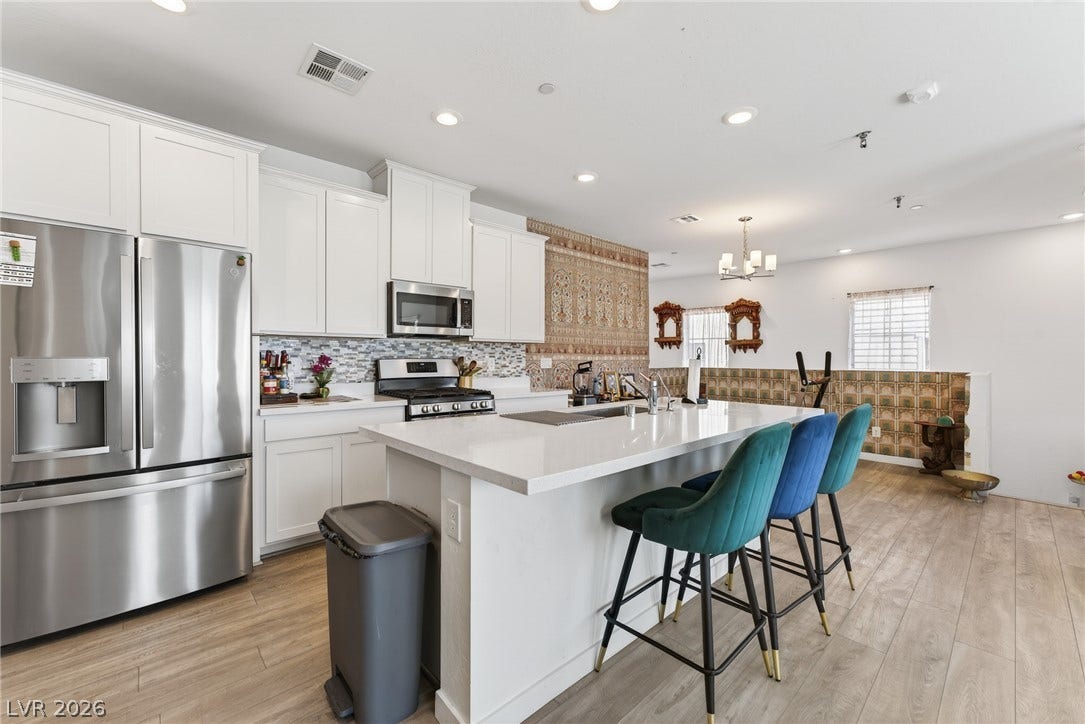 3700 Canis Minor Lane, #19206, Henderson, NV 89052 An open floorplan connects the modern kitchen and dining space seamlessly.