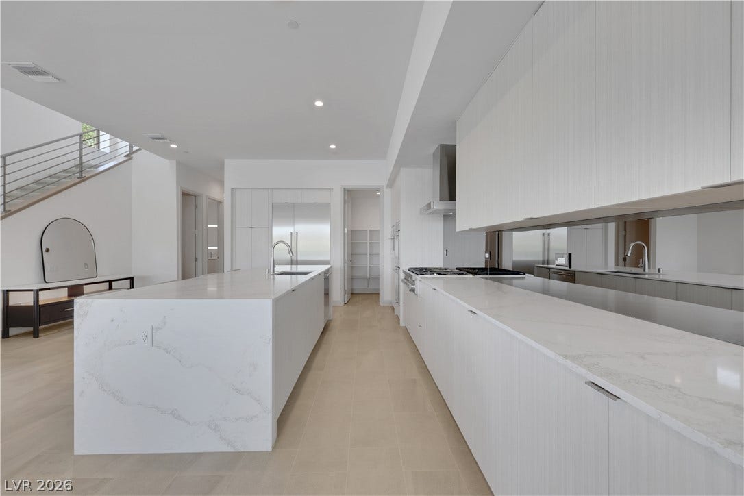66 Lakefront Drive, Henderson, NV 89011 Culinary delights await in this sleek, modern kitchen with dual islands and seamless design.