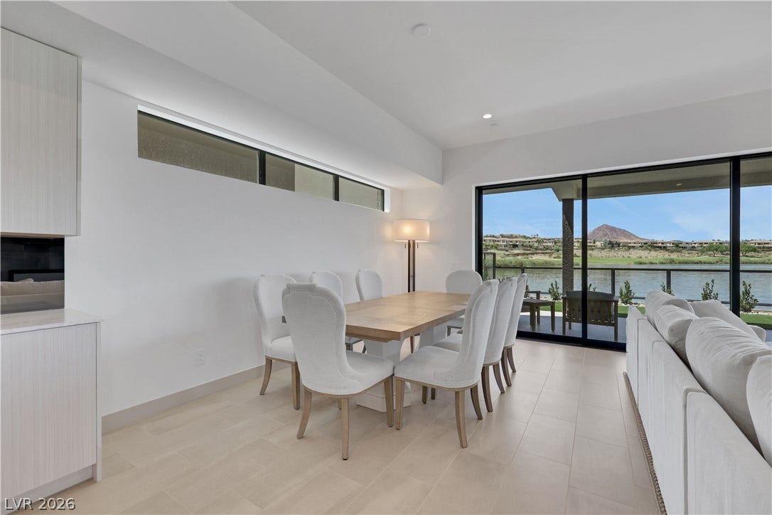 66 Lakefront Drive, Henderson, NV 89011 This naturally illuminated dining space boasts a sleek, minimalist design and expansive water views.
