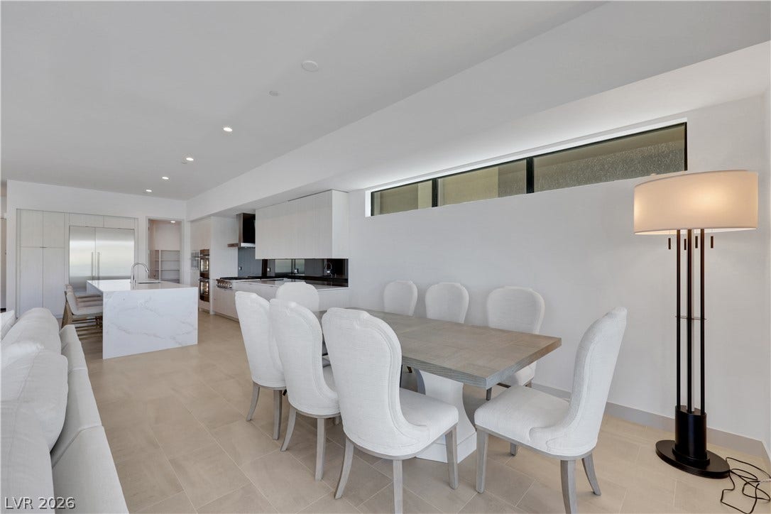 66 Lakefront Drive, Henderson, NV 89011 Clean lines and a luminous atmosphere define this expansive open-concept kitchen and dining area.