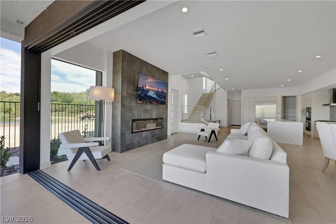 66 Lakefront Drive, Henderson, NV 89011 An open concept living area transitions seamlessly to the outdoors through wide sliding glass doors.