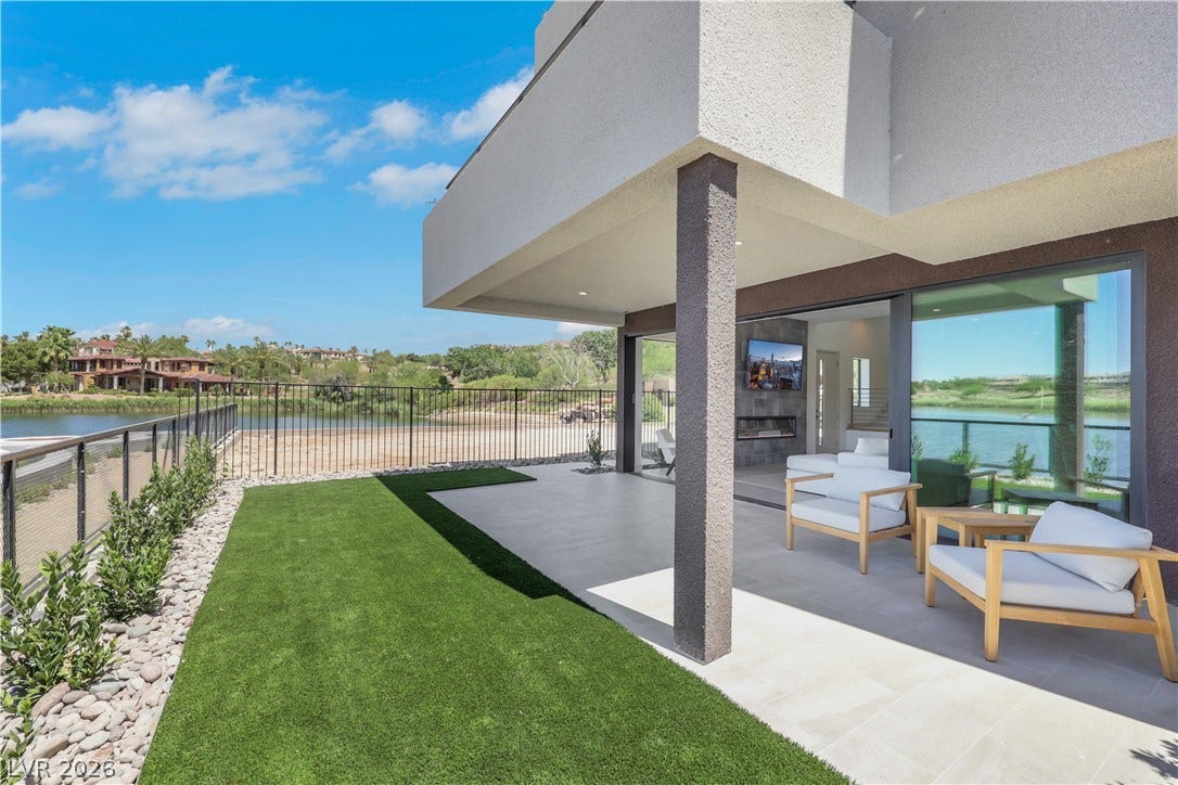 66 Lakefront Drive, Henderson, NV 89011 Lakeside views complement the modern covered patio, offering an ideal space for outdoor relaxation and entertaining.
