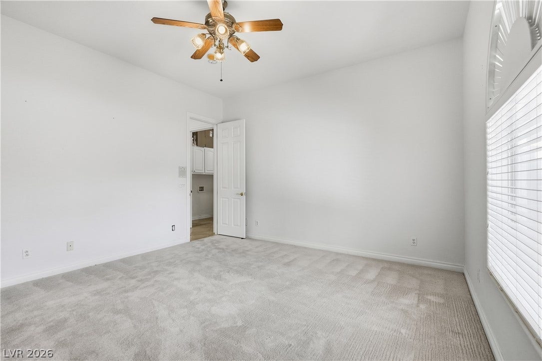 Plush carpeting anchors this versatile room boasting clean lines and generous natural light.