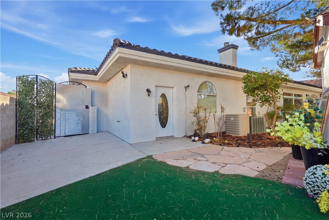Spanish tile roofing and classic stucco walls define this elegant exterior architectural design.