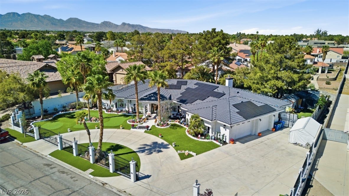 Aerial view of residential area with a mountainous background