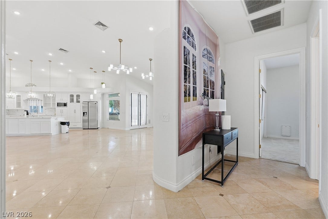Gleaming tile floors stretch throughout this open layout configured for seamless daily living.
