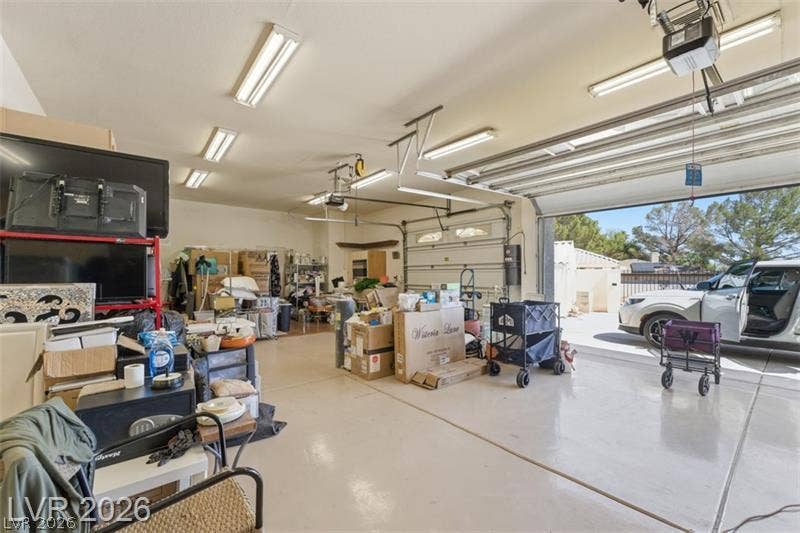 An expansive multi-car garage provides substantial space and smooth concrete flooring.