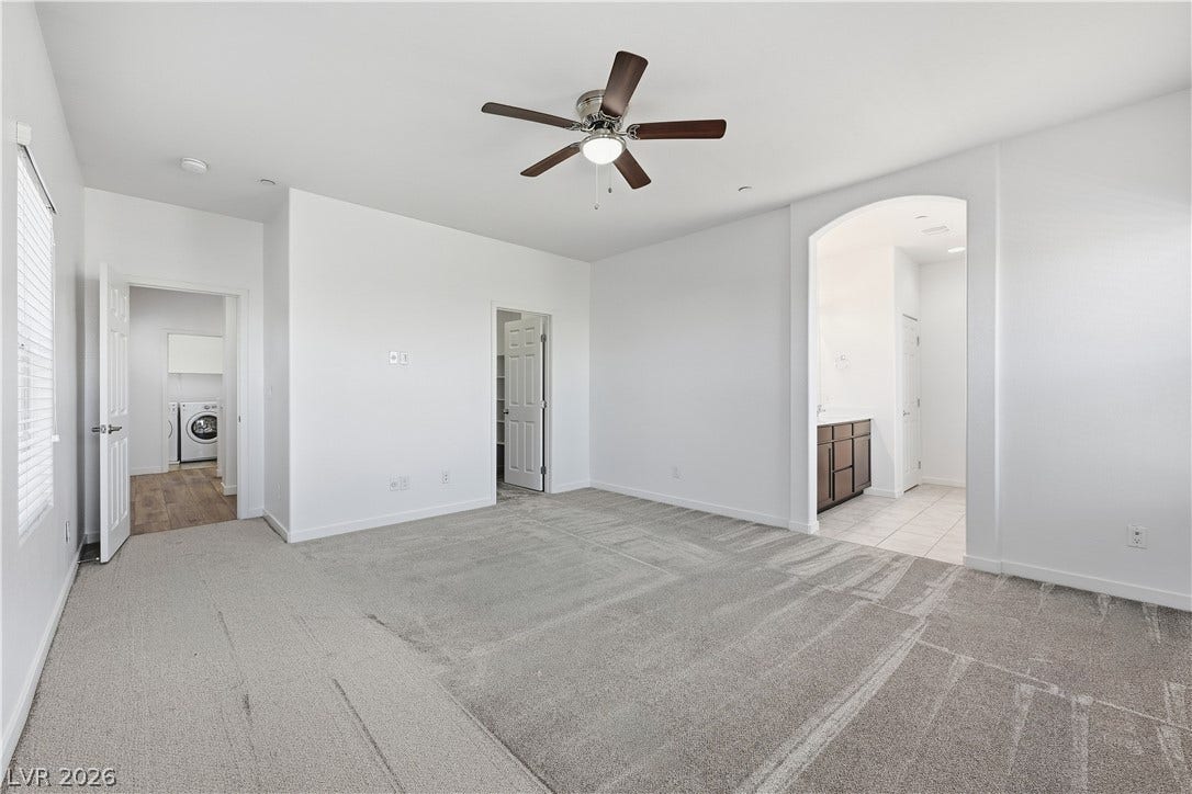 1122 Bradley Bay Avenue, Henderson, NV 89014 A spacious layout connects the primary suite directly to the bath and laundry areas.