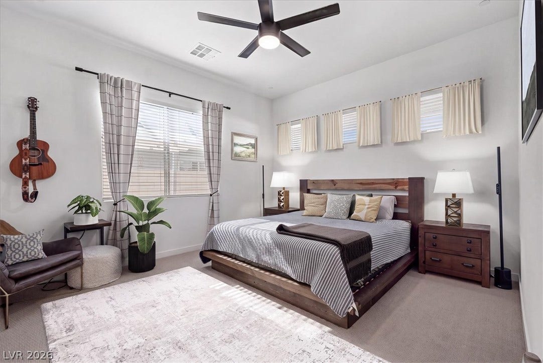 **Virtually Staged** High ceilings and tall windows enhance this comfortable retreat.