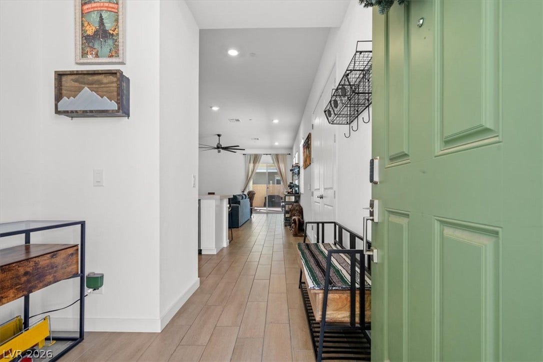 A welcoming entry hall features clean-lined flooring leading toward the main living spaces.