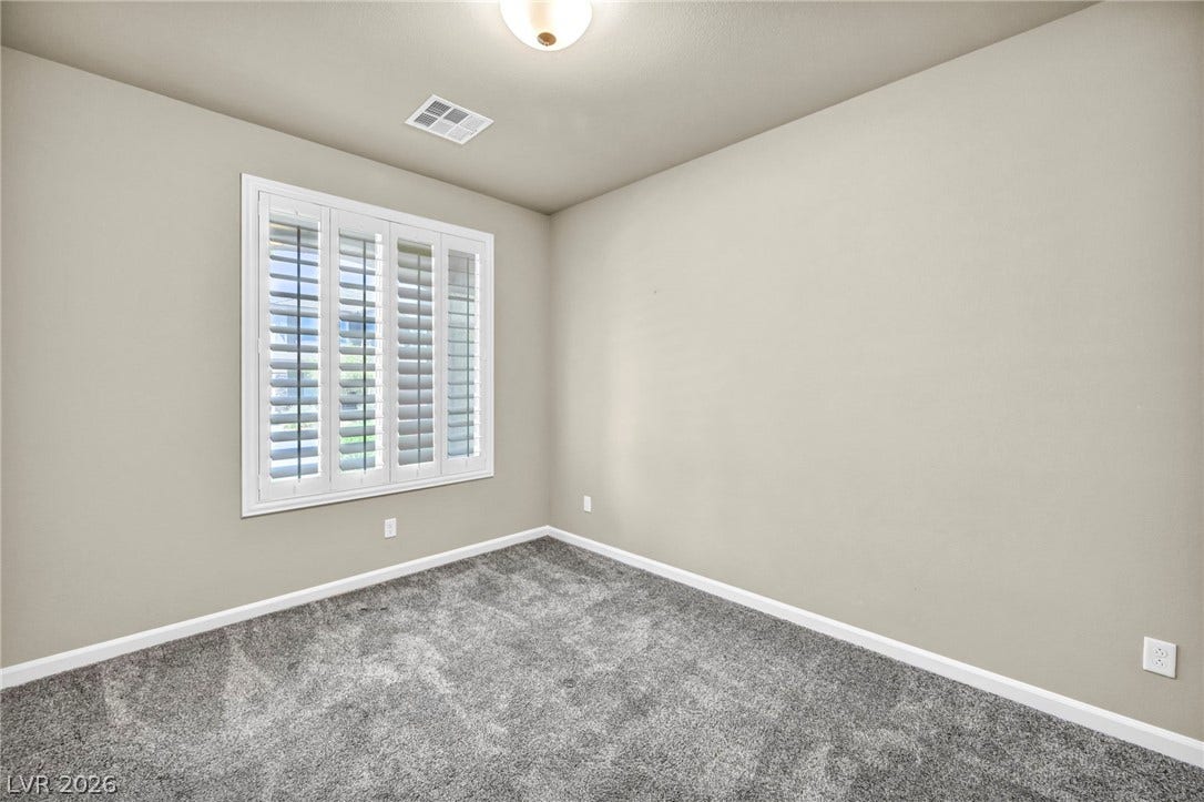 6571 Tangled Vines Avenue, Las Vegas, NV 89139 Soft carpeting underfoot and plantation shutters create a cozy, private atmosphere.