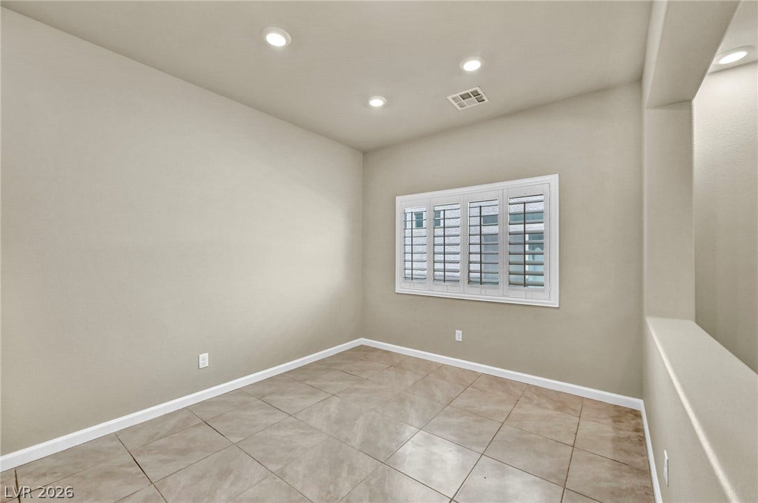 6571 Tangled Vines Avenue, Las Vegas, NV 89139 Recessed lighting and tile floors define this versatile bonus room with plantation shutters.