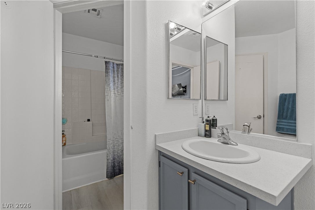 5015 Droubay Drive, Las Vegas, NV 89122 Functional layout elements define this bathroom space with its vanity area and adjacent tub setup.