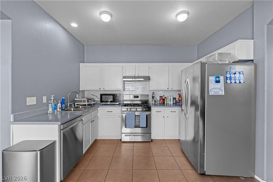 5015 Droubay Drive, Las Vegas, NV 89122 Ample cabinetry and tile flooring define this functional cooking space.