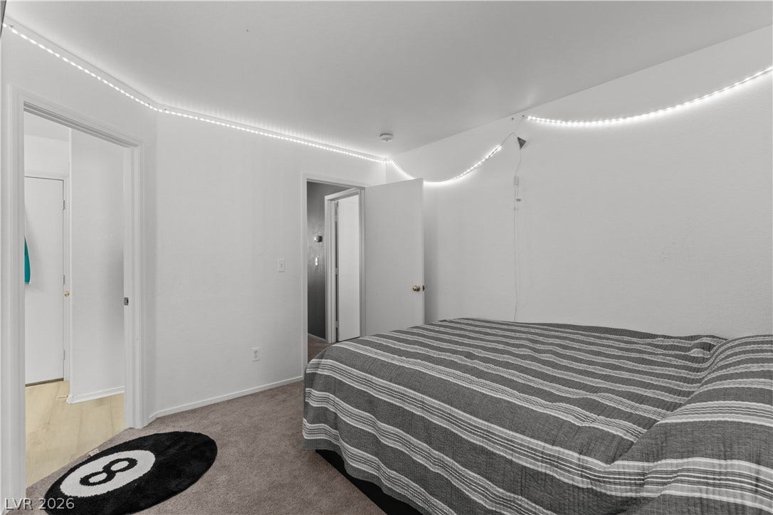 5015 Droubay Drive, Las Vegas, NV 89122 Soft carpeting underfoot defines this cozy sleeping space complete with smooth walls.